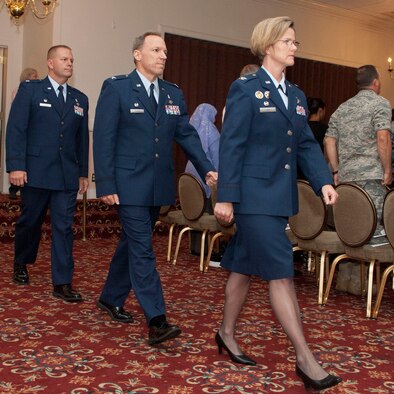 HANSCOM AIR FORCE BASE, Mass. – Col. Stacy L. Yike, 66th Air Base Group commander, leads in Col. Parker Plante and Lt. Col. Frank Glenn during the 66th Medical Squadron Change of Command ceremony at the Minuteman Commons Aug. 10. Colonel Plante, who retired the same day, relinquished command of the squadron to Colonel Glenn. (U.S. Air Force photo by Mark Wyatt)