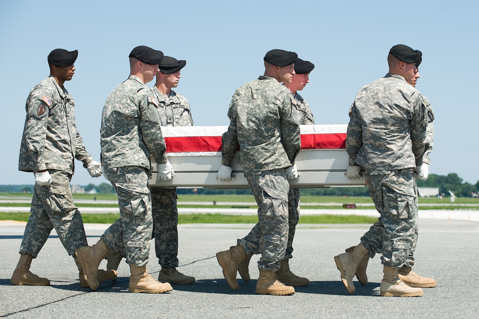 A U.S. Army carry team transfers the remains of Army Spc. Joseph A. VanDreumel of Grand Rapids, Mich., at Dover Air Force Base, Del., Aug. 17, 2011. VanDreumel was assigned to the 1st Battalion, 2nd Infantry Regiment, 172nd Infantry Brigade Grafenwoehr, Germany. (U.S. Air Force photo/Steve Kotecki)