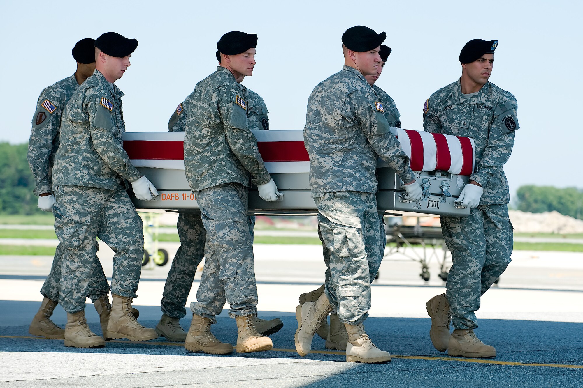 A U.S. Army carry team transfers the remains of Army Sgt. Matthew A. Harmon, of Bagley, Minn., at Dover Air Force Base, Del., Aug. 17, 2011. Harmon was assigned to the 1st Battalion, 2nd Infantry Regiment, 172nd Infantry Brigade Grafenwoehr, Germany. (U.S. Air Force photo/Steve Kotecki)