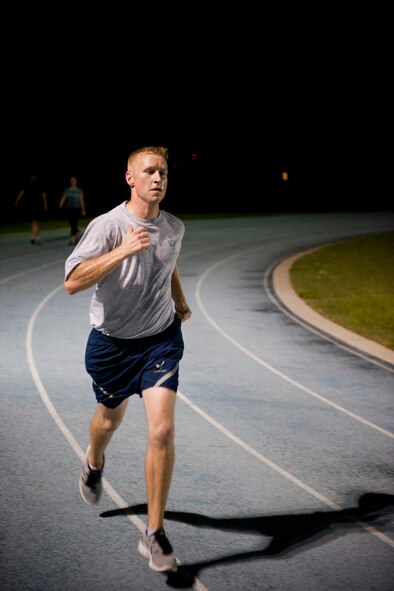 U.S. Air Force Staff Sgt. Aaron Williams, 372nd Training Squadron A-10 avionics instructor, sprints around the running track during a speed workout at Moody Air Force Base, Ga., Aug. 17, 2011. Williams created a 22-week training plan for him and his teammates to follow in preparation for this year’s Air Force Marathon scheduled for Sept. 17 at Wright-Patterson Air Force Base, Ohio. (U.S. Air Force photo by Staff Sgt. Jamal D. Sutter/Released)