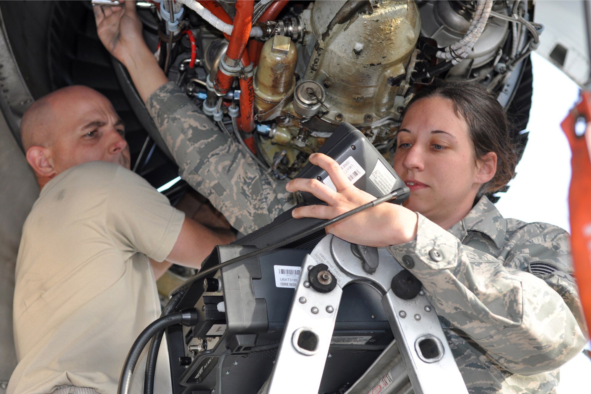 Technical Sgt. Shannon Wright, an A-10 Thunderbolt II engine mechanic and Staff Sgt. Leigh Bohannon, an A-1- electrician assigned to the 917th Fighter Group from Barksdale Air Force Base, La., work on an A-10 engine while deployed to Eielson Air Force Base , Alaska, Aug. 2, 2011. Approximately 100 members of the 917th FG deployed to Alaska to prepare for an upcoming Air and Space Expeditionary rotation. (U.S. Air Force Photo/Senior Master Sgt. Jessica D'Aurizio)
