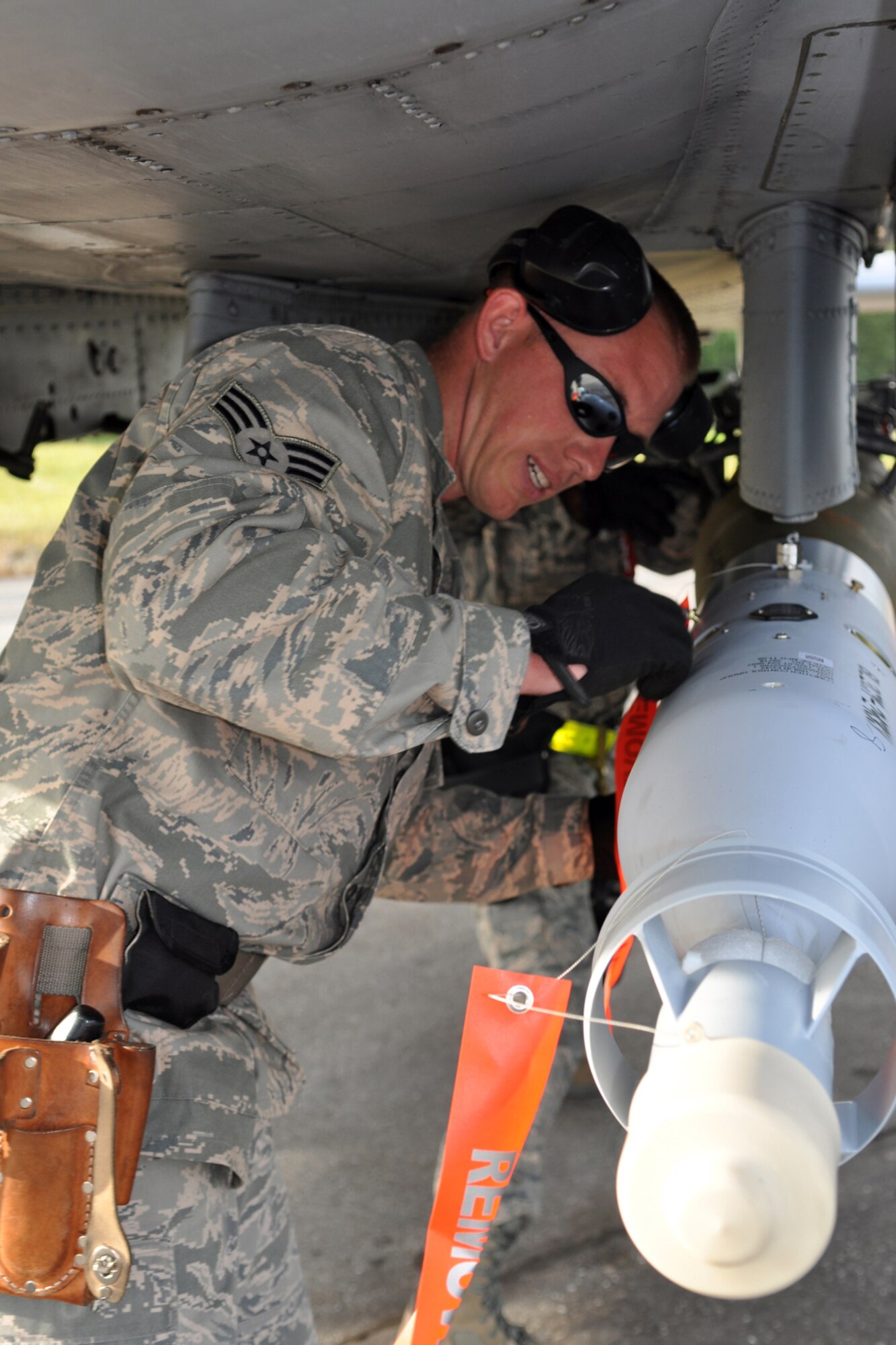 Senior Airman Cody Burt, an A-10 Thunderbolt II weapons loader assigned to the 917th Fighter Group at Barksdale Air Force Base, La., loads a Guided Bomb Unit 12 onto an aircraft while deployed to Eielson Air Force Base, Alaska, Aug. 2, 2011. Approximately 100 members of the 917th FG deployed to Alaska to prepare for an upcoming Air and Space Expeditionary rotation. (U.S. Air Force Photo/Senior Master Sgt. Jessica D'Aurizio)