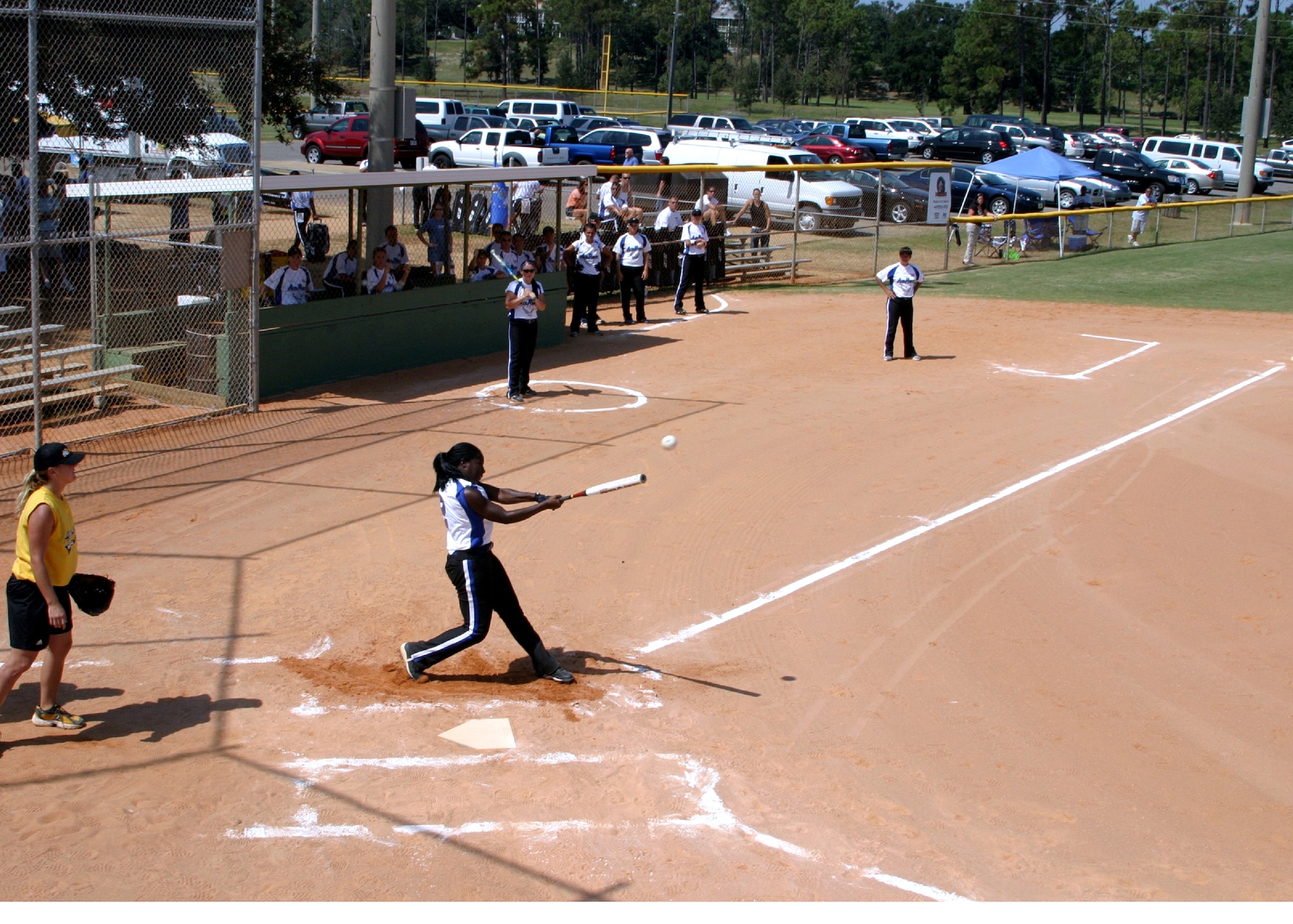 Staff Sgt. Schameka White, 412th Operations Support Squadron Aviation Resource Management, pokes a hit over the third baseman during a game at Naval Air Station Pensacola, Fla. White travels once again to Florida this month to try out for the All-Air Force women’s softball team. She has been part of the team since 2005. (Courtesy photo by Steve Brown)