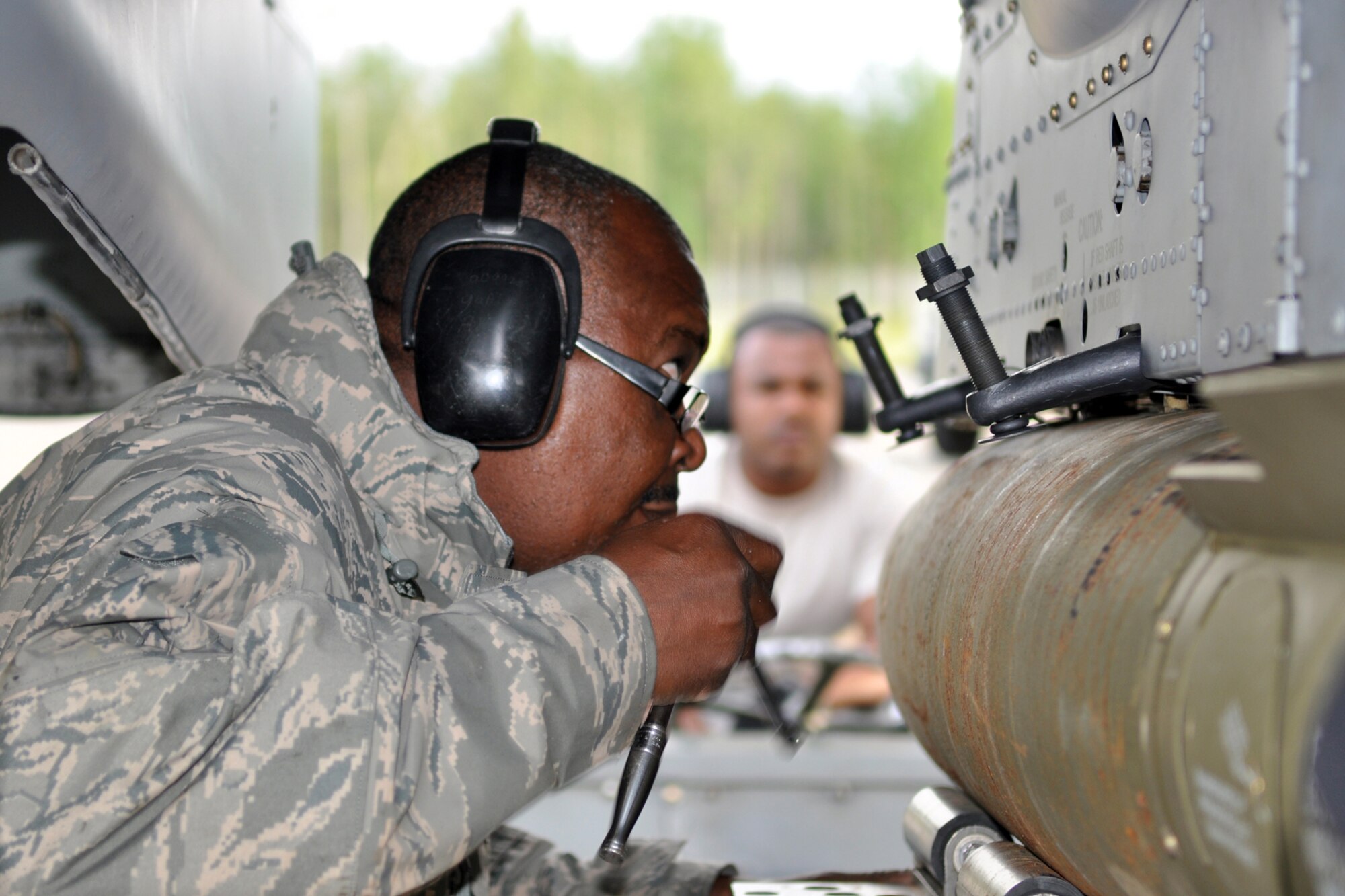 Master Sgt. Vincent Allen, an A-10 Thunderbolt II weapons loading crew chief, loads a live MK-82 air bomb while deployed to Eielson Air Force Base, Alaska, Aug. 2, 2011. Allen is assigned to the 917th Fighter Group from Barksdale Air Force Base, La. Approximately 100 members of the 917th FG deployed to Alaska to prepare for an upcoming Air and Space Expeditionary rotation. (U.S. Air Force Photo/Senior Master Sgt. Jessica D'Aurizio)