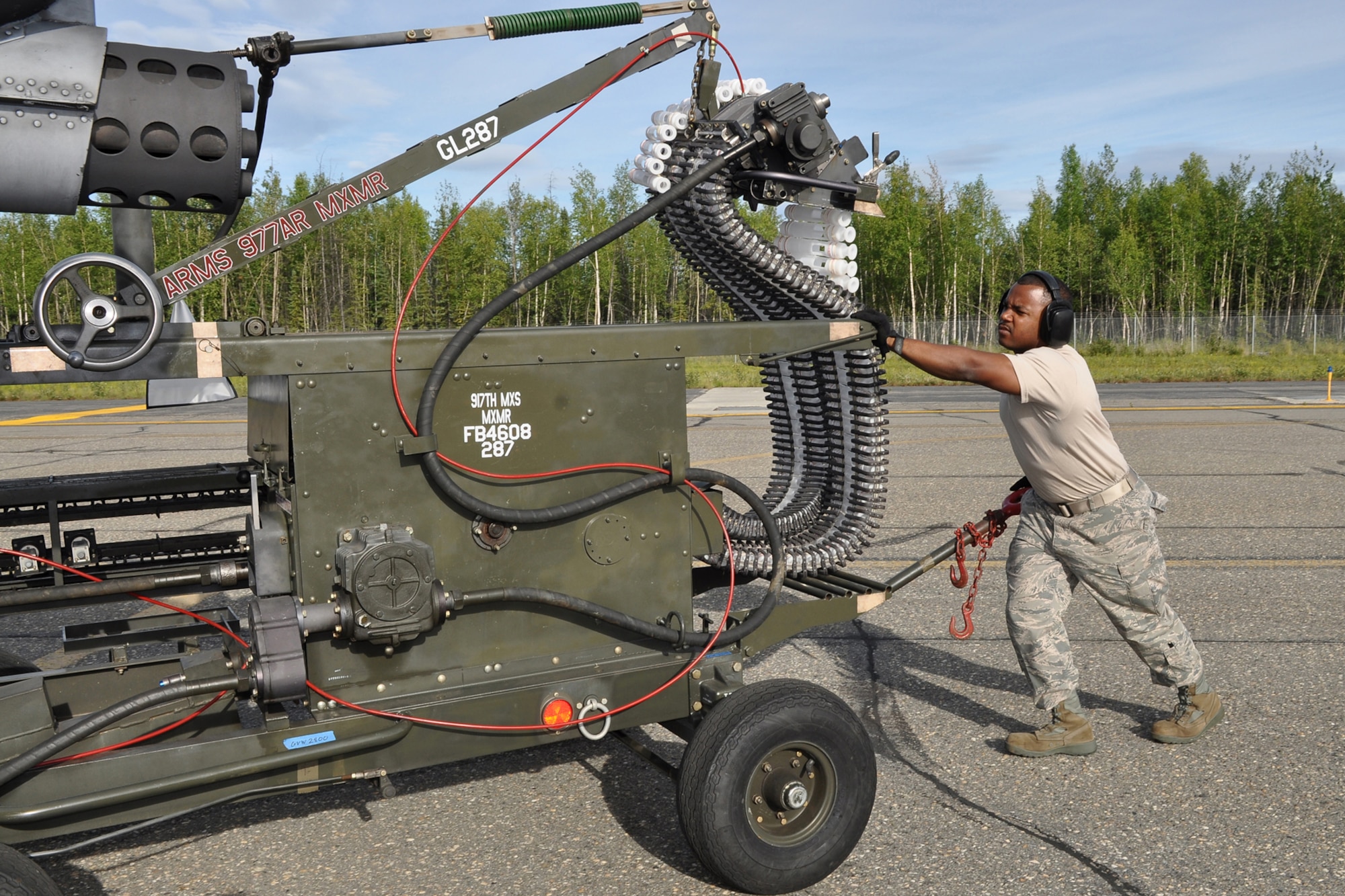 Staff Sgt Terrance Smothers, an A-10 Thunderbolt II weapons loader assigned to the 917th Fighter Group, from Barksdale Air Force Base, La., positions an ammunition loader to replenish 30mm bullets on the A-10 while deployed to Eielson Air Force Base, Alaska, Aug. 2, 2011. Approximately 100 members of the 917th FG deployed to Alaska to prepare for an upcoming Air and Space Expeditionary rotation.  (U.S. Air Force Photo/Senior Master Sgt. Jessica D'Aurizio)