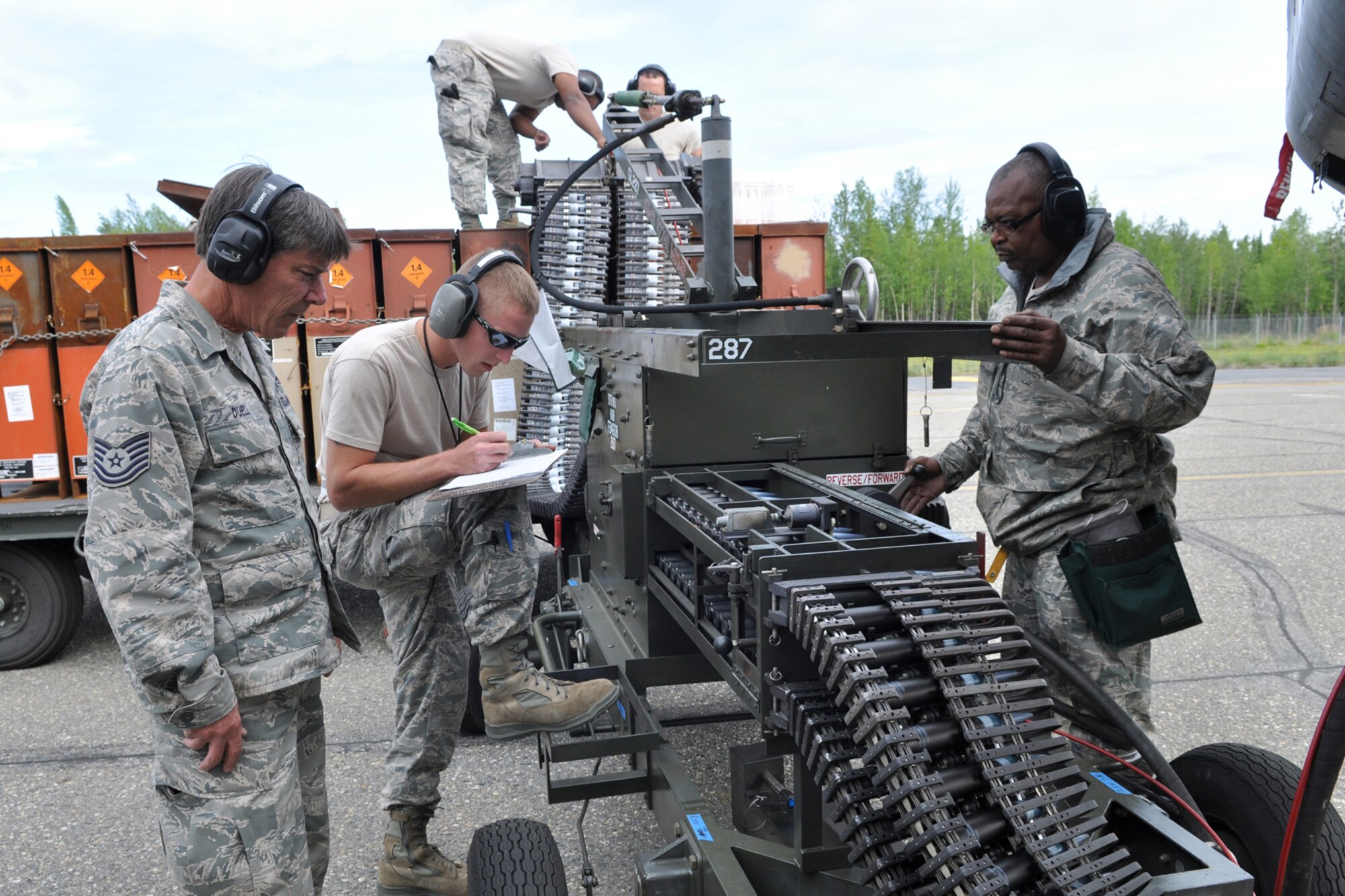 Master Sgt. Mike Duell, Senior Airman Cody Burt and Master Sgt. Vincent Allen, all A-10 Thunderbolt II weapons loaders, replenished 30mm rounds in an A-10 while deployed to Eielson Air Force Base, Alaska, Aug. 2, 2011. The Airmen are assigned to the 917th Fighter Group, Barksdale Air Force Base, La. Approximately 100 members of the 917th FG deployed to Alaska to prepare for an upcoming Air and Space Expeditionary rotation.  (U.S. Air Force Photo/Senior Master Sgt. Jessica D'Aurizio)
