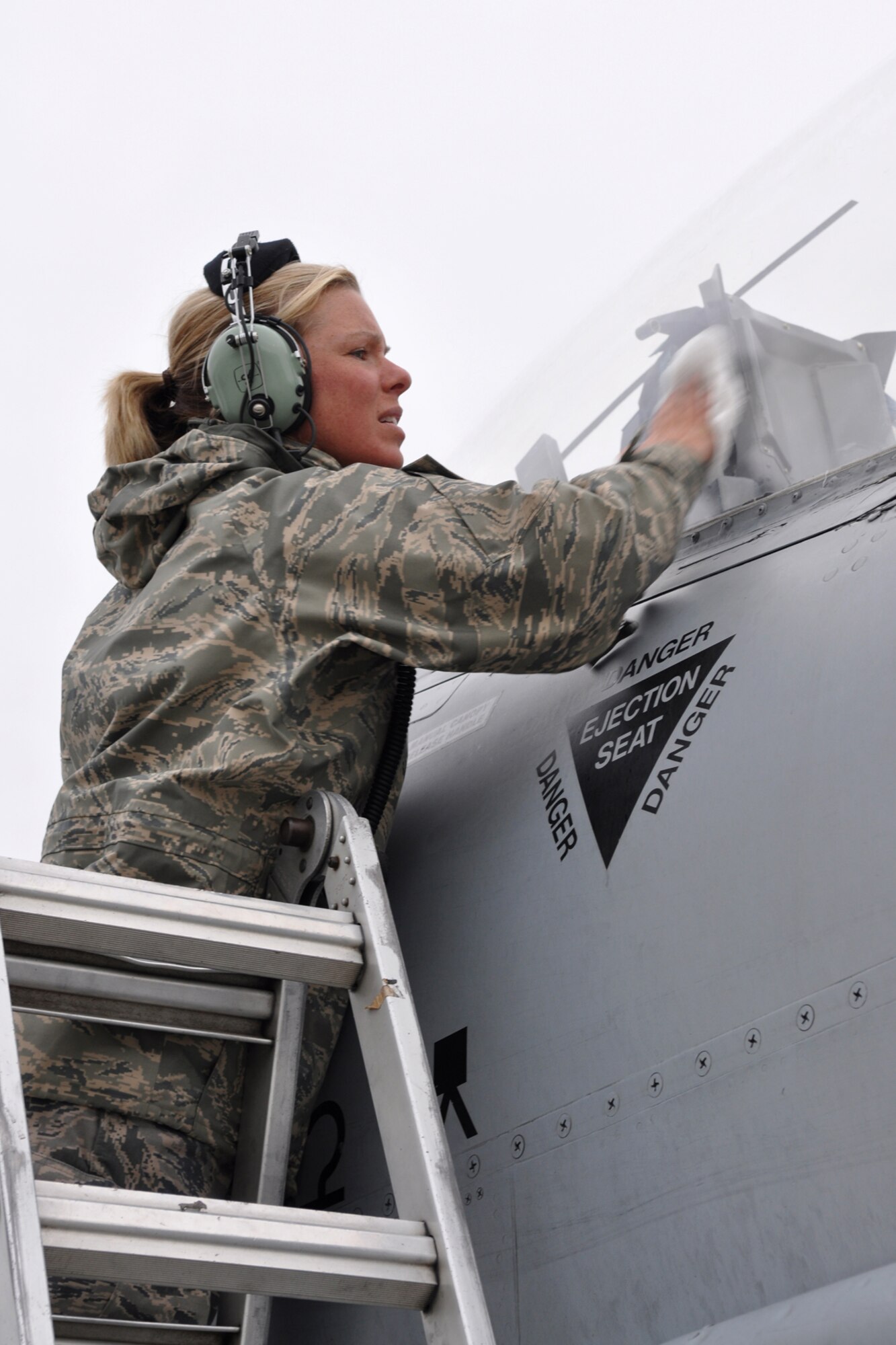 Staff Sgt. Ricki Welch, an A-10 Thunderbolt II crew chief assigned to the 917th Fighter Group at Barksdale Air Force Base, La., cleans the canopy of an A-10 while deployed to Eielson Air Force Base, Alaska, Aug. 2, 2011. Approximately 100 members of the 917th FG deployed to Alaska to prepare for an upcoming Air and Space Expeditionary rotation. (U.S. Air Force Photo/Senior Master Sgt. Jessica D'Aurizio)