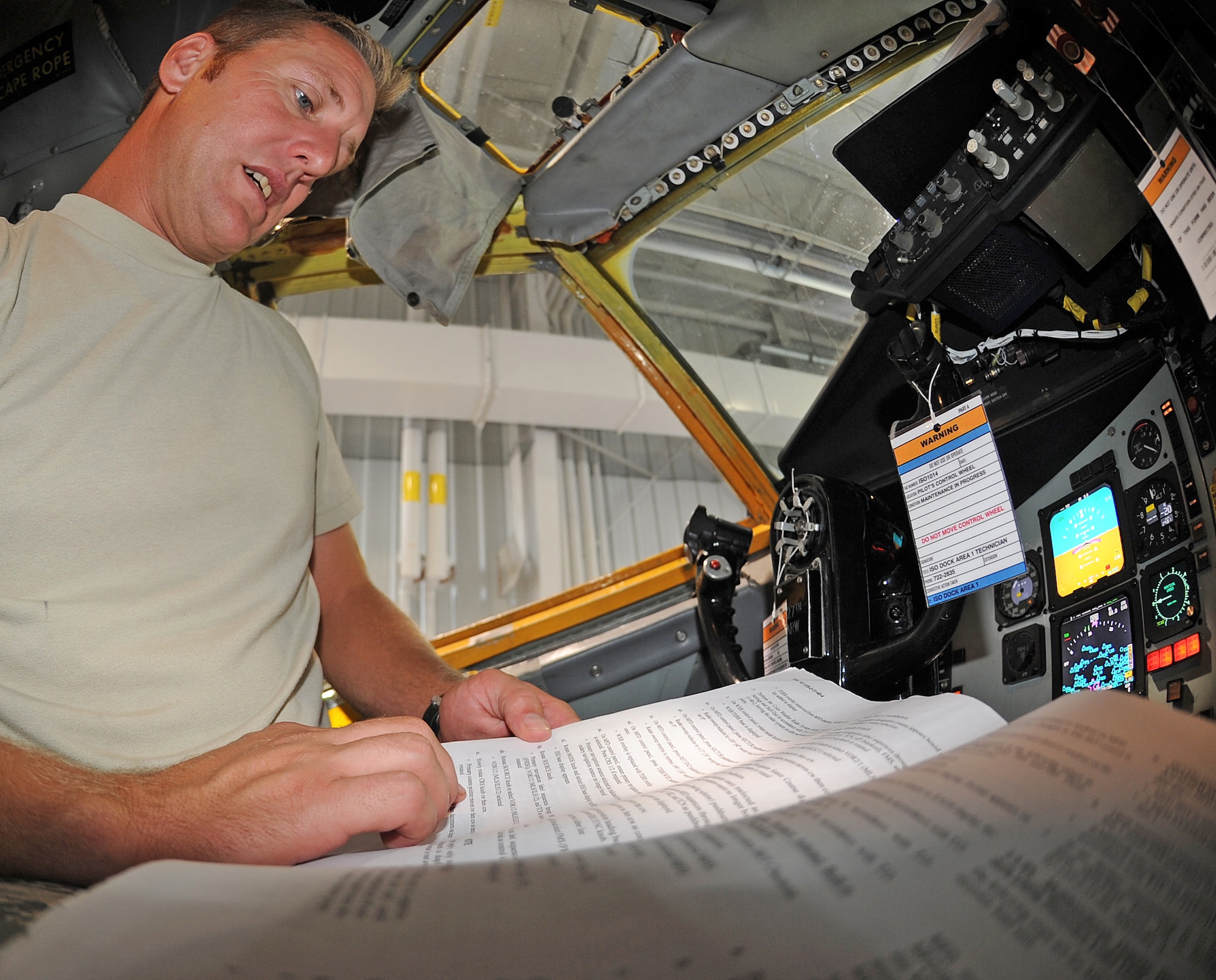 SEYMOUR JOHNSON AIR FORCE BASE, N.C. -- Airman Wesley Miller, 916th Air Refueling Wing integrated avionics systems apprentice, reads the technical order on how to properly test multifunctional displays on a KC-135R Stratotanker. Miller hails from Albertson. (U.S. Air Force photo by Senior Airman Gino Reyes/Released)