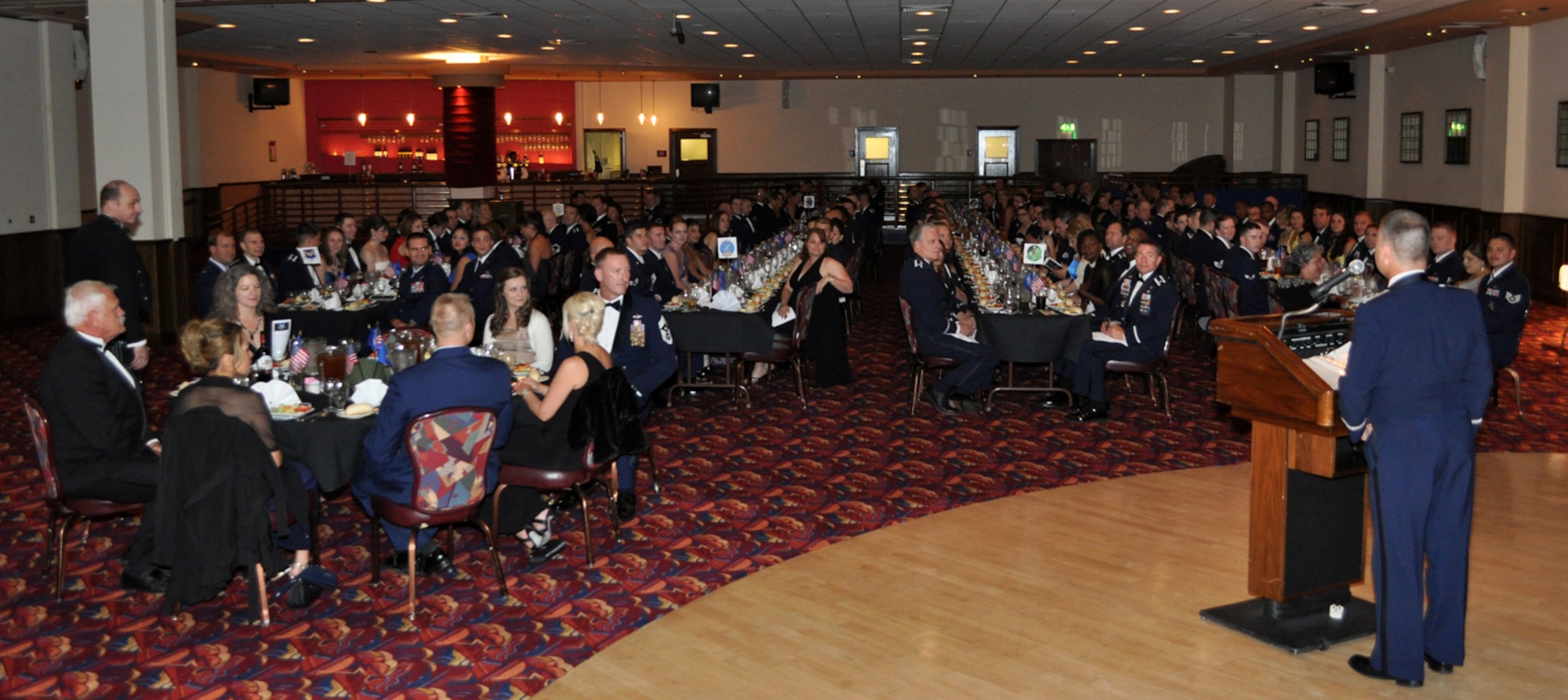 RAF MILDENHALL, England – Col. Gary “Chainsaw” McCollum, Joint Special Operations Air Component-Europe and 352nd Special Operations Group commander, addresses more than 200 people (made up of members of the JSOAC-E and 352nd SOG and their spouses) who gathered in the Galaxy Club July 30, 2011, to celebrate the history and heritage of the 2nd Air Commando Group at the inaugural Air Commando Ball.   Retired Col. Steve Connelly, a prior commander of the 352nd SOG, was the guest speaker at the event and delivered a message on the valor displayed by military members and the sacrifice made by themselves and their families.  (U.S. Air Force photo/Tech. Sgt. Marelise Wood)