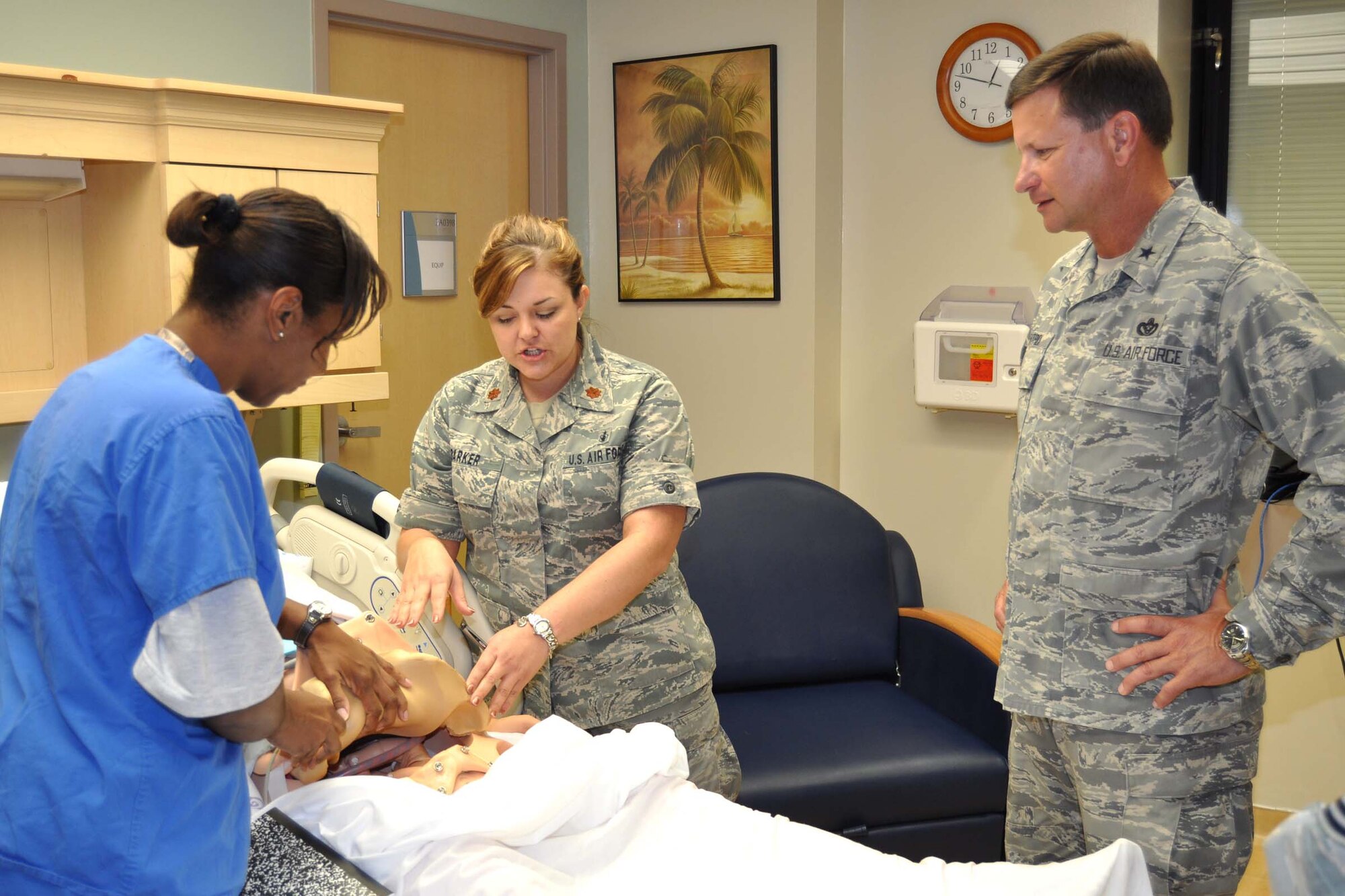Second Lt. Dawn Mitchell, left, assists Maj. Amber Barker, 81st Inpatient Operations Squadron maternal child flight commander, as she explains to Brig. Gen. Leonard Patrick how patient simulator “Katrina” is used to train the family birthing center staff and other associated medics for labor and delivery emergencies. Patrick, who assumed command of 2nd Air Force July 21, was at the 81st Medical Group Aug. 10 as part of a two-day familiarization visit to 81st Training Wing organizations.  (U.S. Air Force photo by Steve Pivnick)