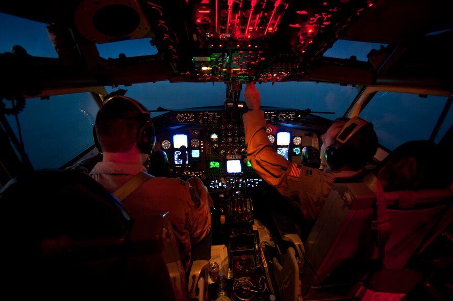 U.S. Air Force Capts. Russell Miller, left, and Matthew Valentino, right, both assigned to the 340th Expeditionary Air Refueling Squadron, fly a KC-135 Stratotanker aircraft during an air refueling mission over Afghanistan Jan. 14, 2011. Miller was with the 64th Air Refueling Squadron and Valentino with the 157th Air Refueling Wing, both deployed from Pease Air National Guard Base, N.H. (U.S. Air Force  photo by Master Sgt. Adrian Cadiz/Released)