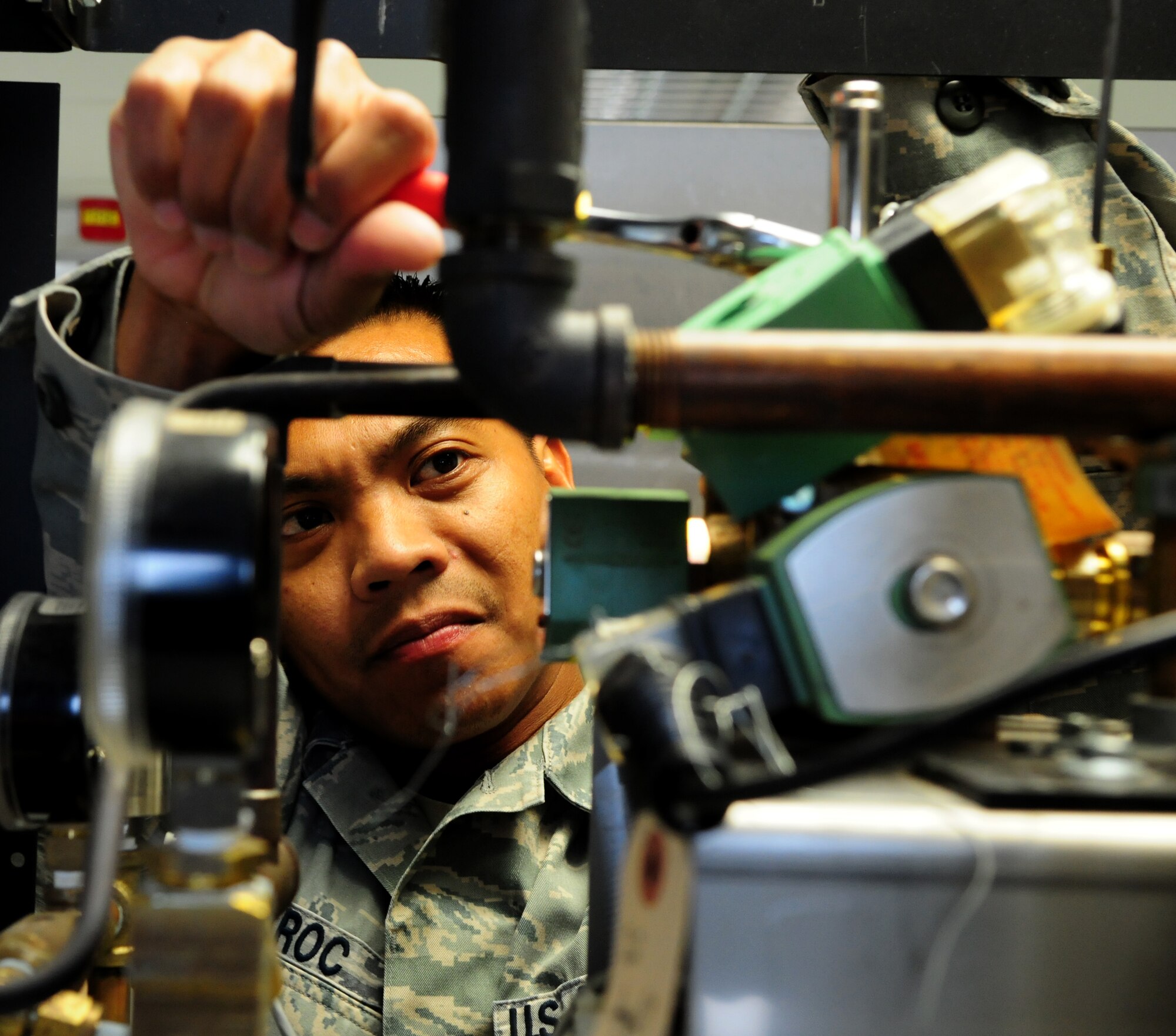 SPANGDAHLEM AIR BASE, Germany – Tech. Sgt. Joey Aroc, 52nd Medical Support Squadron biomedical equipment technician, replaces a part on a dental sterilizer here Aug. 16. Biomedical equipment technicians, part of the 52nd MDSS medical logistics flight, maintain and repair equipment used by the 52nd Medical Group, ensuring they have what they need to keep Saber Airmen and their families healthy. (U.S. Air Force photo/Airman 1st Class Matthew B. Fredericks)