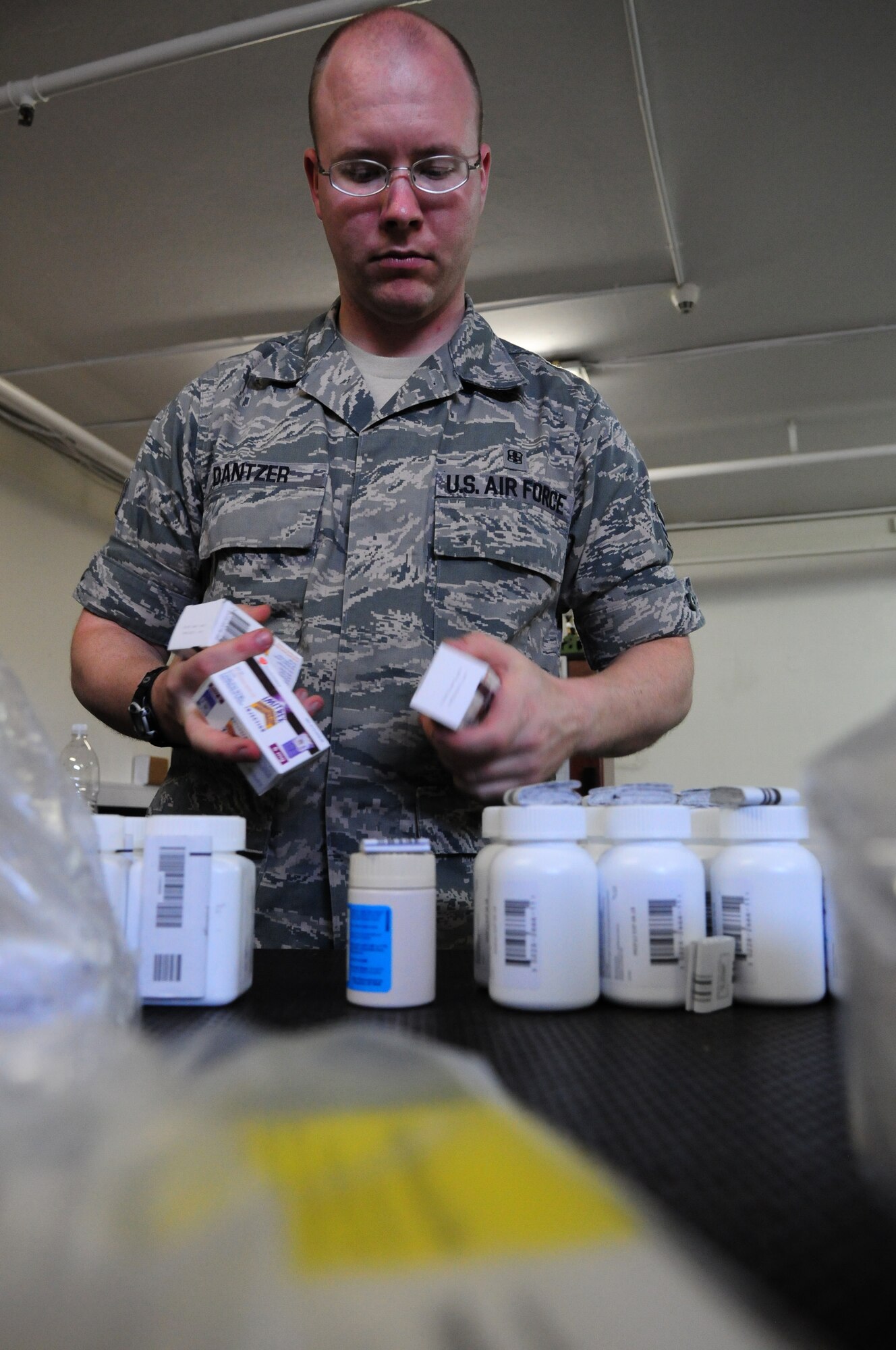 BITBURG ANNEX, Germany – Senior Airman Anthony Dantzer, 52nd Medical Support Squadron medical logistics warehouse technician, sorts medical supplies to be stored in the Bitburg Annex medical logistics warehouse here Aug. 10. The 52nd MDSS Medical Logistics Flight stores and distributes all the medical supplies used by Spangdahlem Air Base and Bitburg Annex, ensuring the 52nd Medical Group has what it needs to keep Saber Airmen and their families healthy. (U.S. Air Force photo/Airman 1st Class Matthew B. Fredericks)