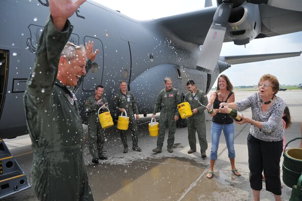 Col. Mark Vijums, 934th Airlift Wing vice commander, celebrates his fini flight with his wife Robin (left) and mother Aug. 5. The colonel's official retirement date is Sept 4. (Air Force Photo/Paul Zadach)