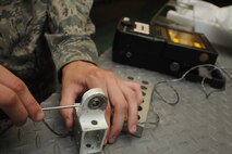 KUNSAN AIR BASE, Republic of Korea -- Senior Airman Benjamin Anderson,
8th Maintenance Squadron nondestructive inspection technician, uses an
Eddy Current Nortec 2000D and demonstrates how it detects flaws here
Aug. 17.  The Eddy Current Nortec 2000D is one of many instruments the
nondestructive inspection team uses to detect minute flaws in aircraft
materials.  (U.S. Air Force photo/Staff Sgt. Rasheen Douglas)


