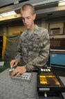 KUNSAN AIR BASE, Republic of Korea -- Senior Airman Benjamin Anderson,
8th Maintenance Squadron nondestructive inspection technician, uses an
Eddy Current Nortec 2000D and demonstrates how it detects flaws here
Aug. 17.  The Eddy Current Nortec 2000D is one of many instruments the
nondestructive inspection team uses to detect minute flaws in aircraft
materials.  (U.S. Air Force photo/Staff Sgt. Rasheen Douglas)



