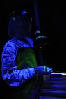 KUNSAN AIR BASE, Republic of Korea -- Senior Airman Kelli Tompkins, 8th
Maintenance Squadron nondestructive inspection technician, uses an
ultraviolet light and a special dye to detect flaws during an inspection
of aircraft components here Aug. 17.  The nondestructive inspection team
inspects aircraft parts, checking for stress and hairline fractures in
the aircraft material.  (U.S. Air Force photo/Staff Sgt. Rasheen Douglas)

