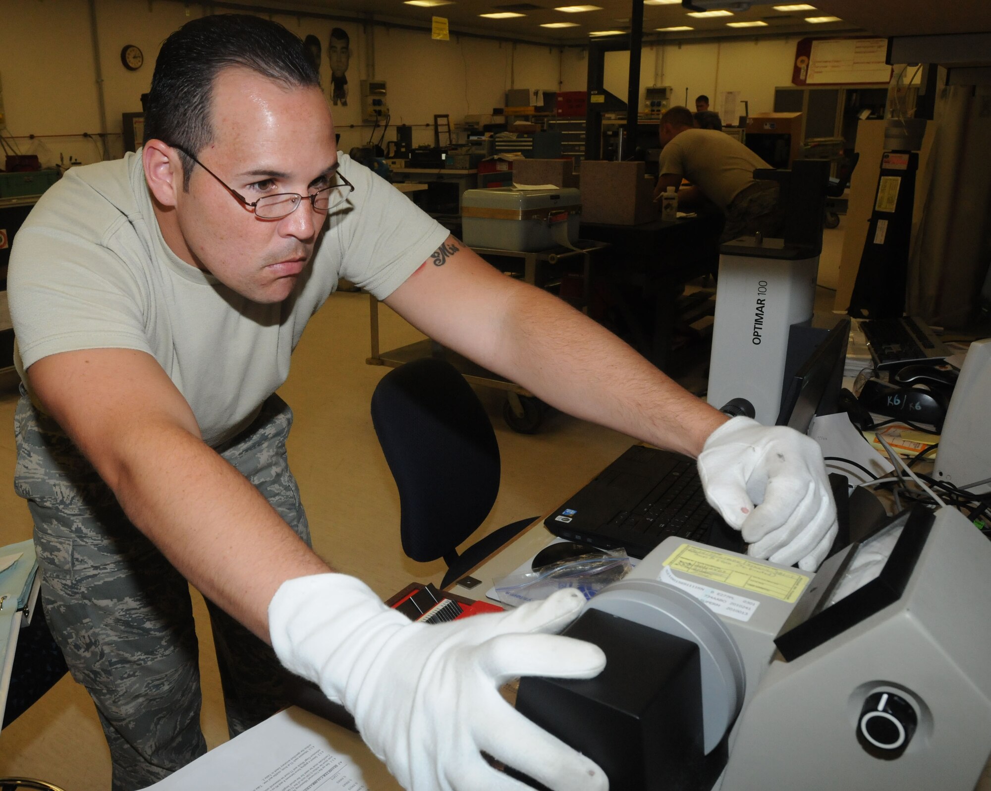 Staff Sgt. Juan Mercado Guzman calibrates a gas port erosion tool Aug. 16 at Aviano Air Base, Italy. Mercado Guzman works in the 31st Maintenance squadron?s precision measurement laboratory as a technical measurement diagnostics equipment technician.  The PMEL office members calibrate more than 6,000 pressure measuring devices for seven different bases throughout Europe. (U.S. Air Force photo/Airman LaVel Sterling)