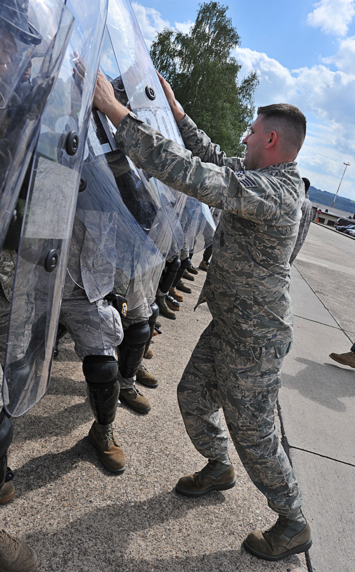 Air Force Staff Sgt. Justin Allen, 86th Security Forces Squadron training instructor, simulates a protestor during confrontation management class at Ramstein Air Base, Germany, Aug. 16, 2011. The 86th SFS trains for confrontation management (riot control) to defend the base populace and its resources from violent protestors; it is also a core task of SF members. (U.S. Air Force photo by Airman 1st Class Desiree Esposito)
