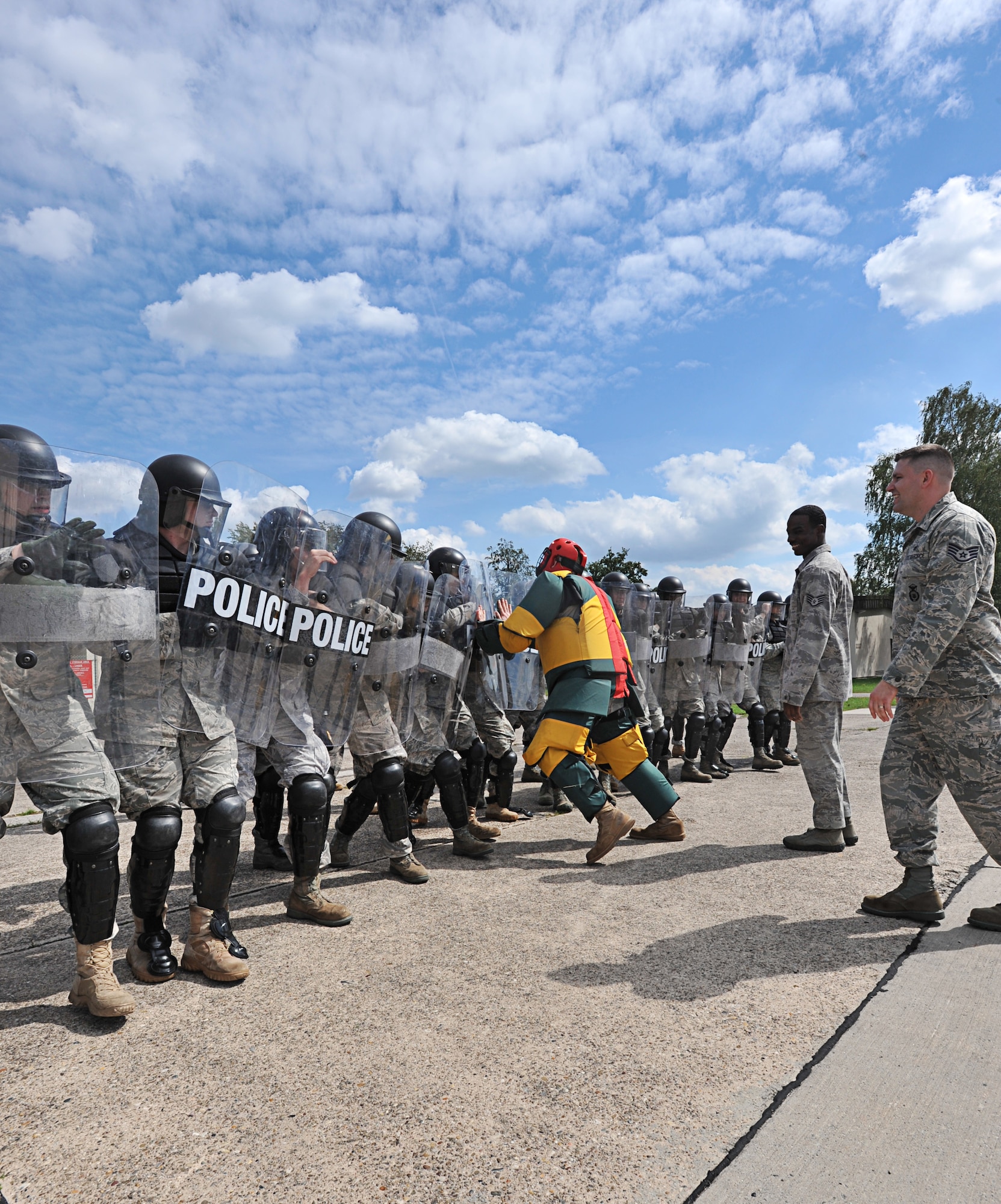 Air Force 86th Security Forces Squadron members participate in a simulated protest exercise during confrontation management class at Ramstein Air Base, Germany, Aug. 16, 2011. The 86th SFS trains for confrontation management (riot control) to defend the base populace and its resources from violent protestors; it is also a core task of SF members. (U.S. Air Force photo by Airman 1st Class Desiree Esposito)