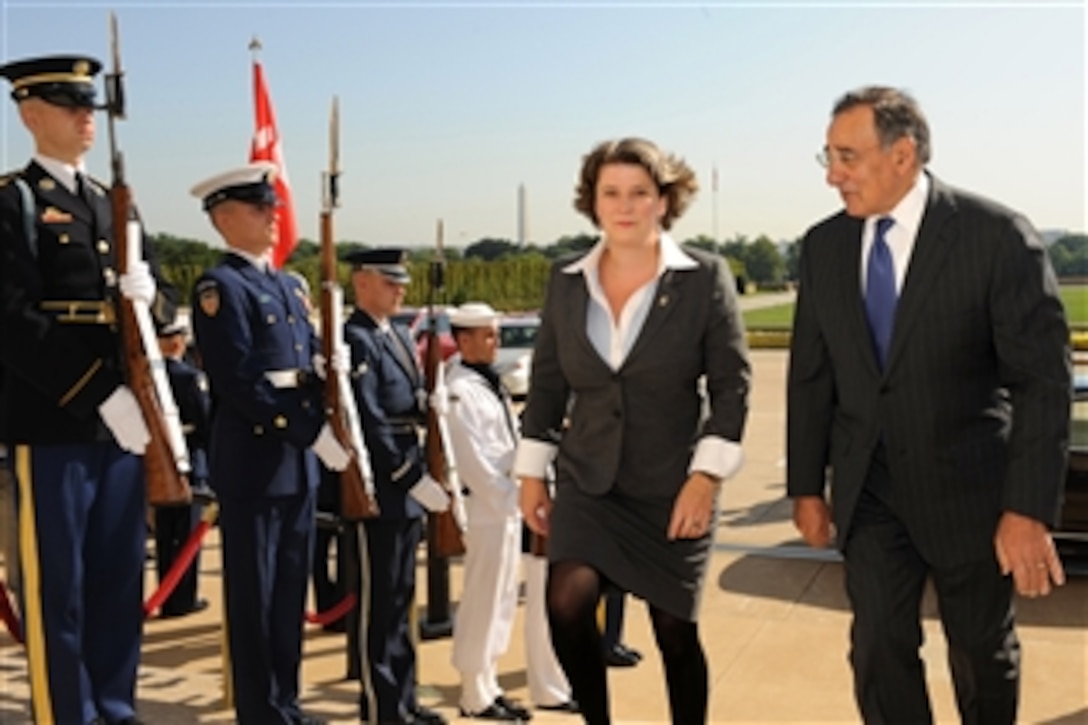 Secretary of Defense Leon E. Panetta escorts Danish Defense Minister Gitte Lillelund Bech through an honor cordon and into the Pentagon on Aug. 17, 2011.  Panetta and Bech will hold talks on a broad range of security issues.  