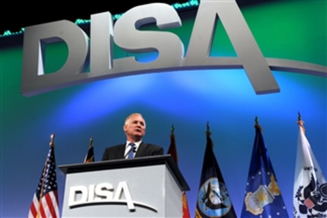 Deputy Secretary of Defense William J. Lynn III addresses the audience at the Defense Information Systems Agency Customer and Industry Forum held at the Baltimore Convention Center, Baltimore, Maryland, on Aug. 16, 2011.  Lynn's speech dealt with the threats of cyber warfare in the digital age.  