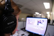 KUNSAN AIR BASE, Republic of Korea -- Airman 1st Class Victoria Secrist, American Forces Network Korea broadcast producer, uses non-linear editing software to edit a news story here Aug. 17. AFN Kunsan produces weekly news stories and features highlighting Kunsan Air Base happenings, initiatives and people. (U.S. Air Force photo/Senior Airman Brittany Y. Bateman)