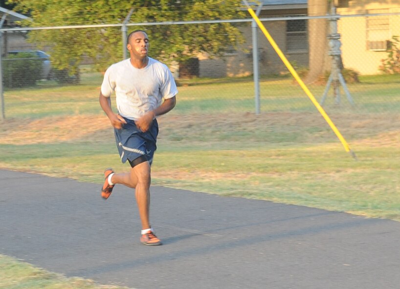 Airman 1st Class Ernest Sereal, 2nd Civil Engineer Squadron, runs in the "Back to School" fun run on Barksdale Air Force Base, La., Aug. 18. The run was approximately 2.7 miles long followed by a raffle give-away of various prizes. (U.S. Air Force photo/Senior Airman Kristin High)(RELEASED) 