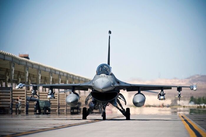 A U.S. Air Force F-16 Fighting Falcon from Shaw Air Force Base, S.C., departs for a training mission during Green Flag-West 11-9 Aug. 15, 2011, at Nellis AFB, Nev. Green Flag-West provides a realistic close-air support training environment for forces preparing to support worldwide combat operations.(U.S. Air Force photo by Senior Airman Brett Clashman/Released)