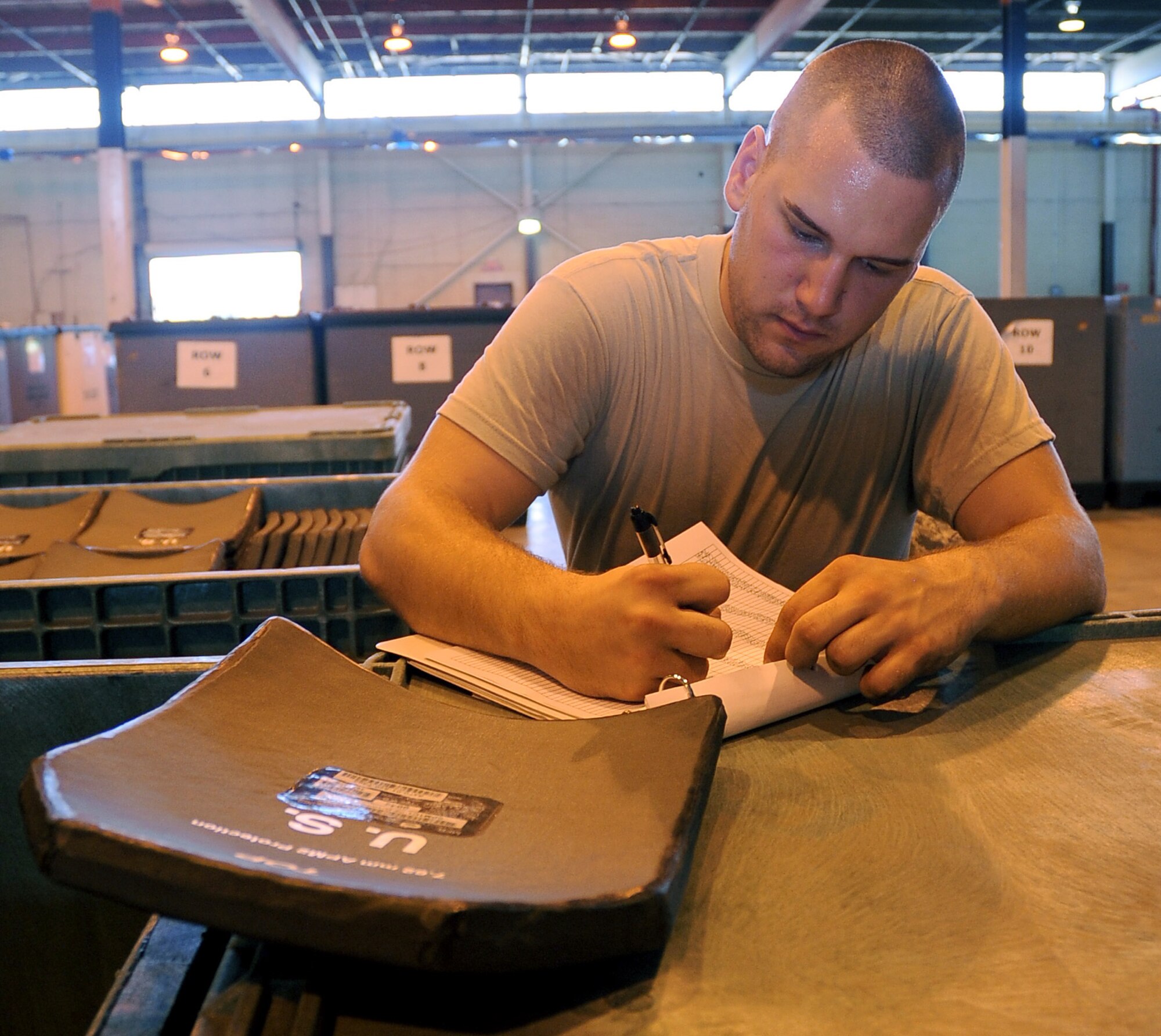 Senior Airman Justin Walczyk, 2nd Logistics Readiness Squadron mobility and weapons section, inventories small arms protective inserts on Barksdale Air Force Base, La., Aug. 17. All individual protective equipment that is received or returned to the 2 LRS warehouse is updated in a large spreadsheet for proper inventory. (U.S. Air Force photo/Senior Airman Amber Ashcraft) (RELEASED)
