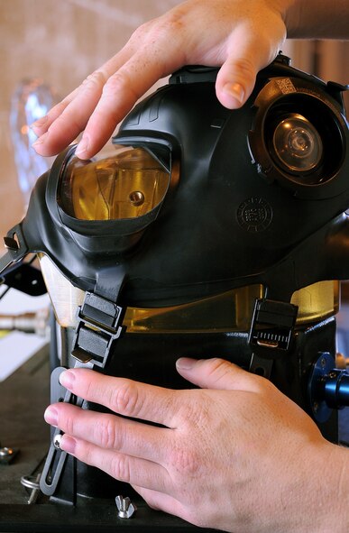 Senior Airman Sarah Lanzillo, 2nd Logistics Readiness Squadron mobility and weapons section, preps an M-50 Joint Service General Purpose Mask to be tested for proper sealing and function on Barksdale Air Force Base, La., Aug. 17. Although most of the base populace is still using the MCU-2A/P or the Mickey 2, all masks must be leak tested before being issued to Airmen. (U.S. Air Force photo/Senior Airman Amber Ashcraft) (RELEASED)