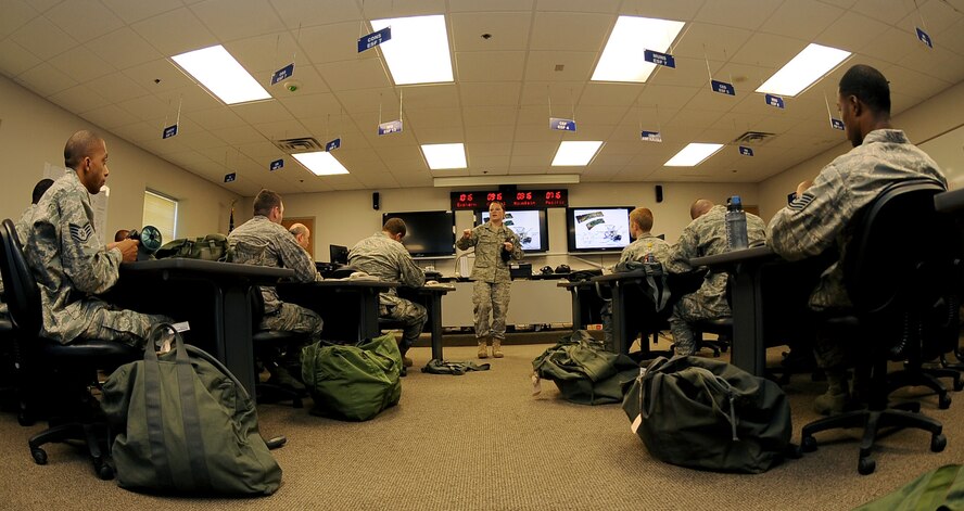 Senior Airman Nika Kliebert, 2nd Civil Engineer Squadron Emergency Management flight, speaks to more than 20 Airmen attending the chemical, biological, radiological, nuclear and high-yield explosive class on Barksdale Air Force Base, La., Aug. 18. The EM flight teaches the CBRNE class several times a month to keep Barksdale Airmen up to date with their training requirements. (U.S. Air Force photo/Senior Airman Amber Ashcraft) (RELEASED)