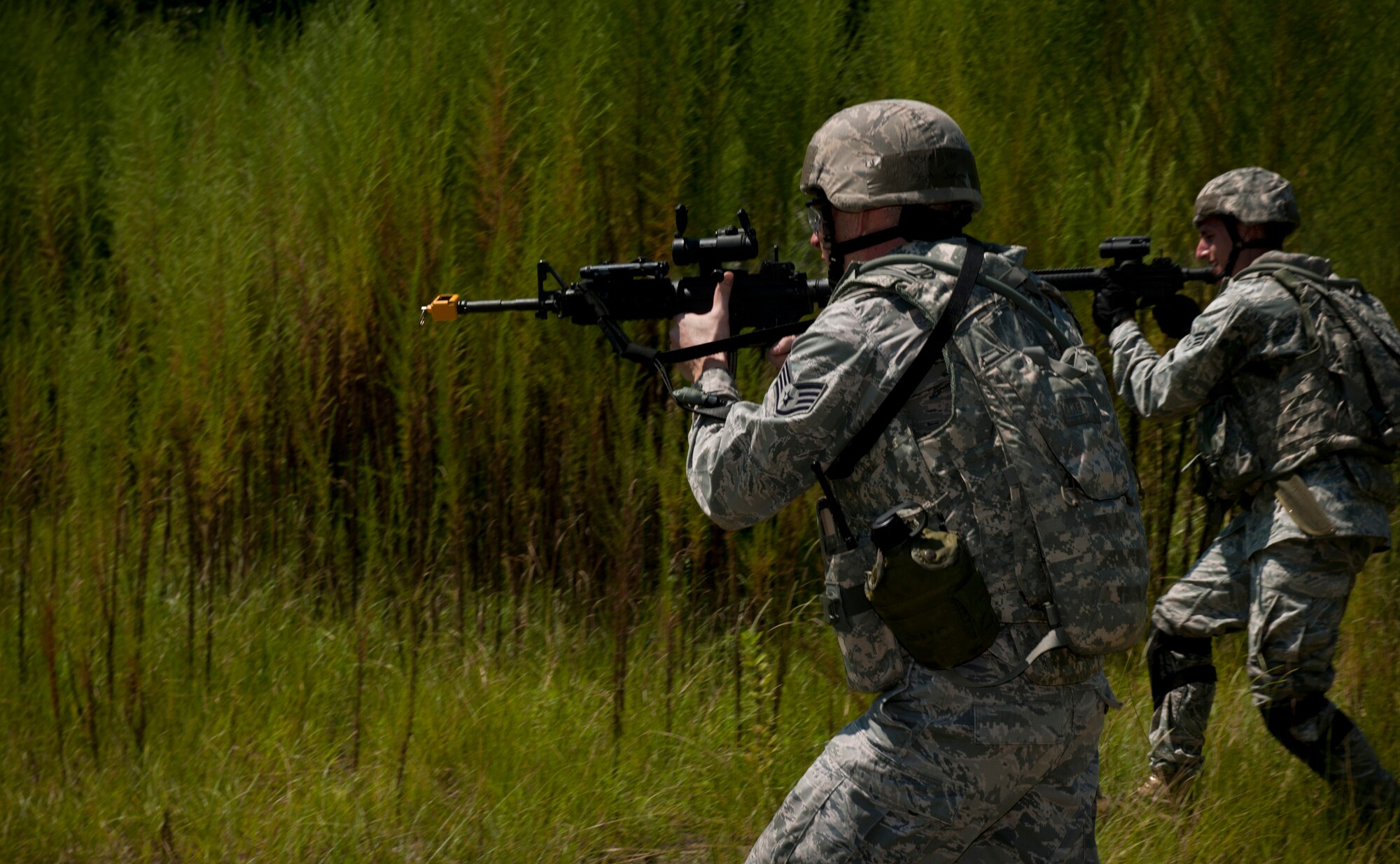 Airmen from the 23rd Security Forces Squadron engage opposing forces during a phase II operational readiness exercise at Moody Air Force Base, Ga., Aug. 17, 2011. In the altercation between the 23rd SFS and the opposing forces, one team laid down suppressive fire while the other members conducted a sweep maneuver to apprehend the opposing forces. (U.S. Air Force photo by Airman 1st Class Joshua Green/Released)
