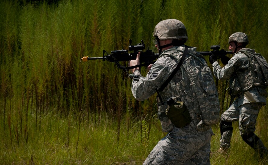 Airmen from the 23rd Security Forces Squadron engage opposing forces during a phase II operational readiness exercise at Moody Air Force Base, Ga., Aug. 17, 2011. In the altercation between the 23rd SFS and the opposing forces, one team laid down suppressive fire while the other members conducted a sweep maneuver to apprehend the opposing forces. (U.S. Air Force photo by Airman 1st Class Joshua Green/Released)
