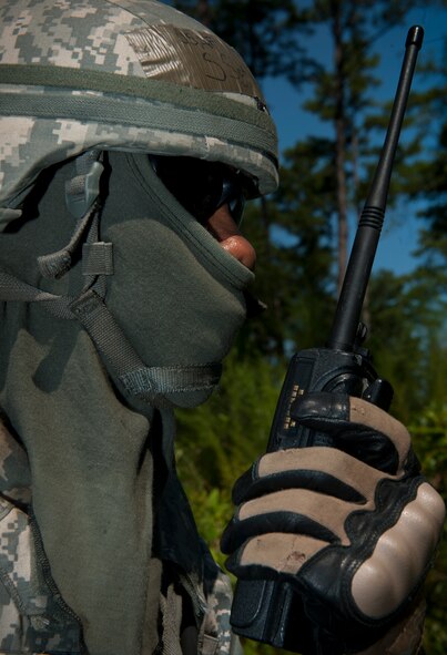 U.S. Air Force Staff Sgt. Ronnie Ward, 23rd Security Forces Squadron patrolman, makes radio contact with other units of his team before engaging with opposing forces during a phase II operational readiness exercise at Moody Air Force Base, Ga., Aug. 17, 2011. Besides having a squad leader, the three separate teams had unit leaders who provided them instructions to maneuver in the field. (U.S. Air Force photo by Airman 1st Class Joshua Green/Released)
