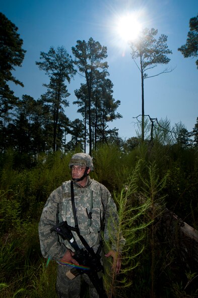 U.S. Air Force Tech. Sgt. David Lamyotte, 23rd Security Forces Squadron NCO in charge, monitors Airmen within his unit while searching for opposing forces during a phase II operational readiness exercise at Moody Air Force Base, Ga., Aug. 17, 2011. Lamyotte and his team patrolled an area where suspicious activity was reported. (U.S. Air Force photo by Airman 1st Class Joshua Green/Released)
