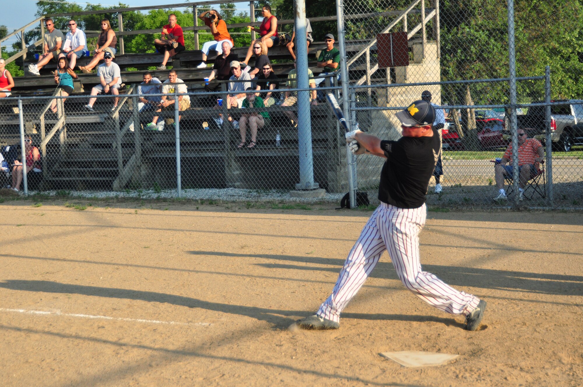 WRIGHT-PATTERSON AIR FORCE BASE, Ohio – Tech. John Stevens, 445th Aircraft Maintenance Squadron, hits one out into the field during the July 9 Active Duty vs. Reserves Softball Challenge July 9. (U.S. Air Force photo/Senior Airman Mikhail Berlin)