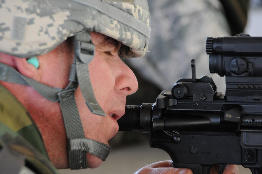 Master Sgt. Kyle Young, structural team member with the 126th Civil Engineering Squadron, fires his M-4 rifle during weapons qualification training at Vandenberg Air Force Base, Calif. The Illinois Air National Guard squadron, from Scott Air Force Base, Ill., is in California doing two weeks of annual training at Camp Roberts. The Army National Guard training base was created in 1941 to support troops leaving for World War II and is now in need of repairs to buildings and infrastructure. Air National Guard Civil Engineering squadrons, known as "Prime Beef" units when deployed, are using the opportunity to train on real world electrical, structural, plumbing and heavy equipment scenarios. This creates a  collaboration that proves valuable to both National Guard components.
