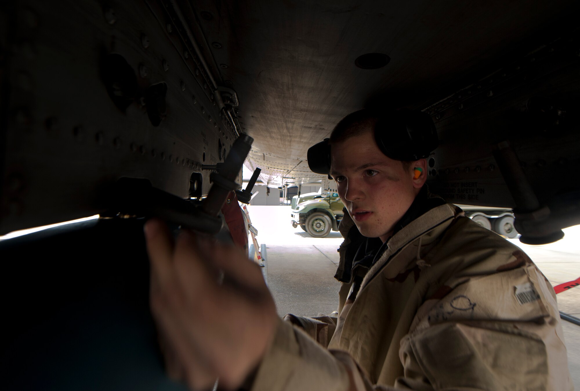 U.S. Air Force Airman 1st Class Trenton Metyk, 23rd Aircraft Maintenance Squadron weapons armament specialist, loosens bolts on a Mark 82 bomb attached to an A-10C Thunderbolt II during a phase II operational readiness exercise at Moody Air Force Base, Ga., Aug. 17, 2001. During the exercise, load crews and maintenance personnel conducted operations as if they were at a deployed location. (U.S. Air Force photo by Airman 1st Class Joshua Green/Released)
