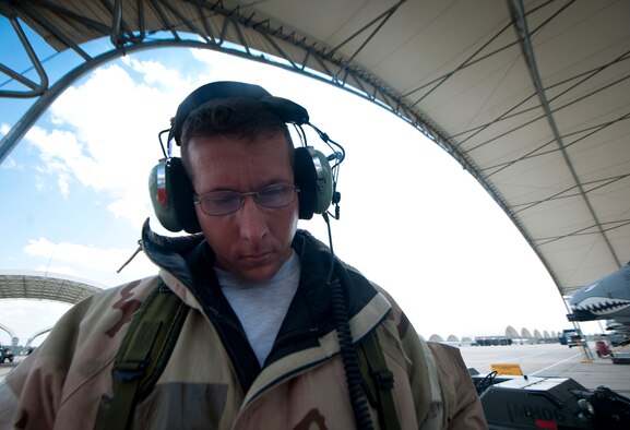 U.S. Air Force Tech. Sgt. Jarrod Gibson, 723rd Aircraft Maintenance Squadron A-10C Thunderbolt II crew chief, reviews technical orders for a preflight maintenance check during a phase II operational readiness exercise at Moody Air Force Base, Ga., Aug. 17, 2001. Gibson and his crew members are required to ensure that the A-10 is capable of flying in a deployed environment while completing the mission. (U.S. Air Force photo by Airman 1st Class Joshua Green/Released)
