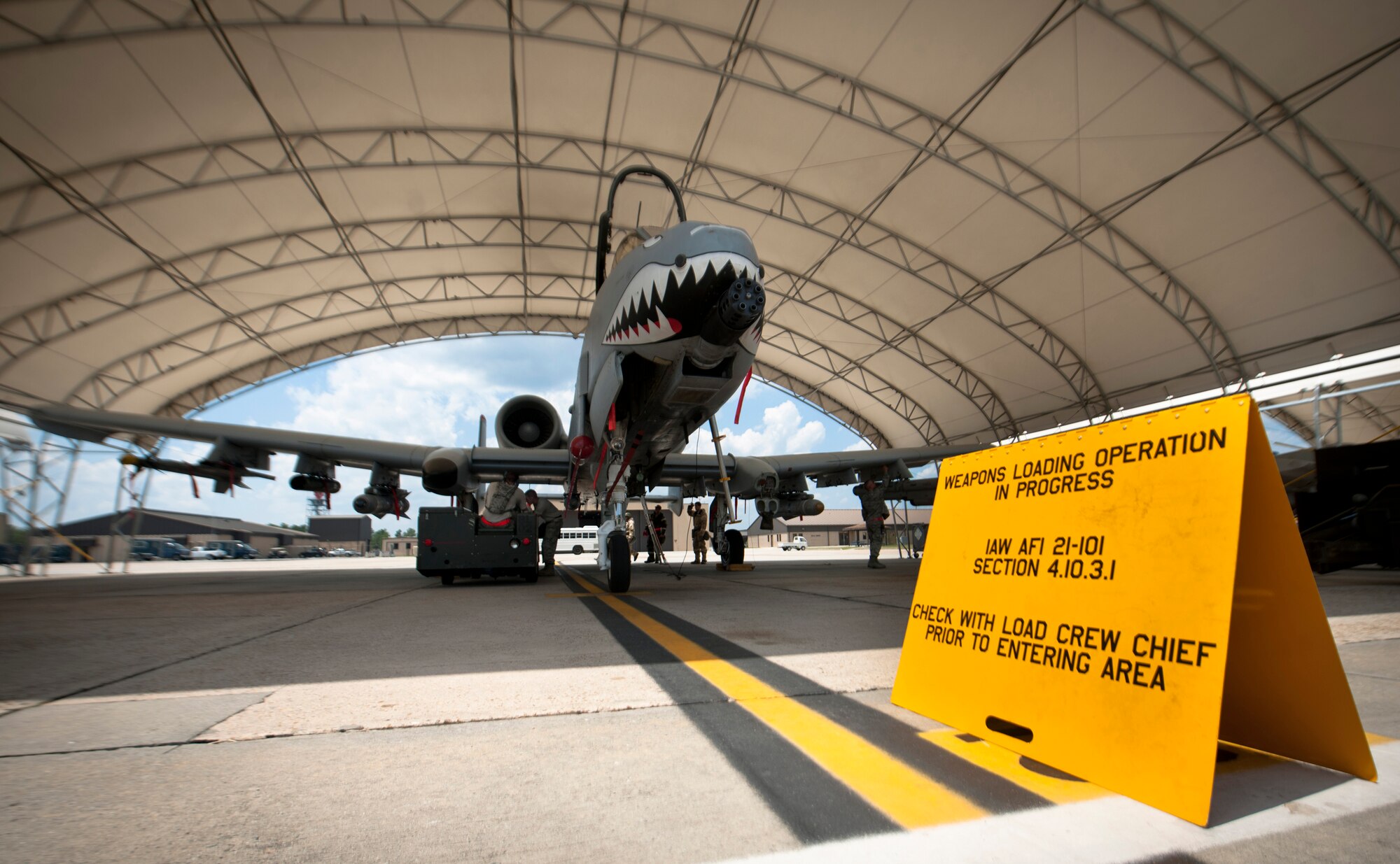 A caution sign sits outside the hangar of an A-10C Thunderbolt II during a phase II operational readiness exercise flying surge at Moody Air Force Base, Ga., Aug. 17, 2001. The exercise was conducted to prepare the wing for the operational readiness inspection in the near future. (U.S. Air Force photo by Airman 1st Class Joshua Green/Released)
