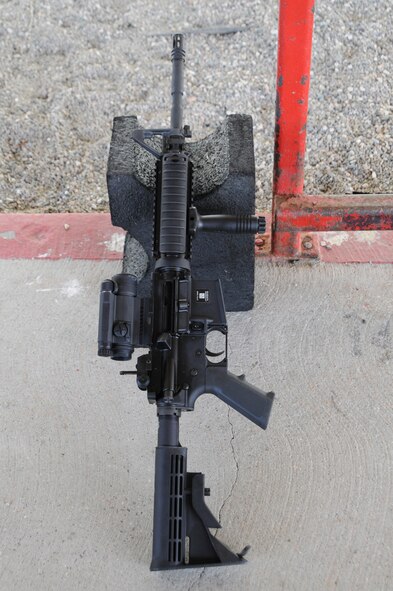 An M-4 rifle lies on a support block during weapons qualification training at Vandenberg Air Force Base, Calif. The 126th Civil Engineering Squadron, Illinois Air National Guard, from Scott Air Force Base, Ill., is in California doing two weeks of annual training at Camp Roberts. The Army National Guard training base was created in 1941 to support troops leaving for World War II and is now in need of repairs to buildings and infrastructure. Air National Guard Civil Engineering squadrons, known as "Prime Beef" units when deployed, are using the opportunity to train on real world electrical, structural, plumbing and heavy equipment scenarios. This creates a  collaboration that proves valuable to both National Guard components.