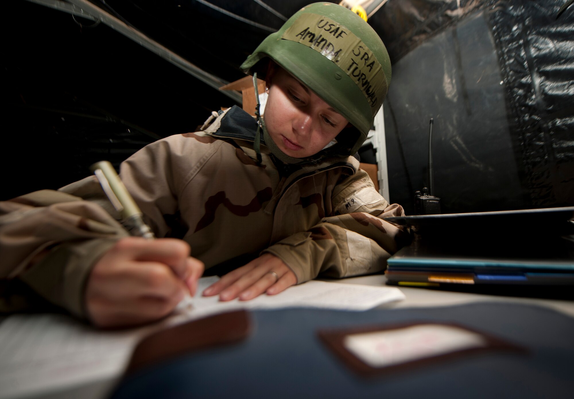 U.S. Air Force Senior Airman Amanda Turnwald, 23rd Force Support Squadron food services specialist, writes down information on individuals who ate at the dining facility during a phase II operational readiness exercise (ORE) at Moody Air Force Base, Ga., Aug. 16, 2011. This was the first time the dining facility was used at Moody for a phase II ORE. (U.S. Air Force photo by Airman 1st Class Joshua Green/Released)
