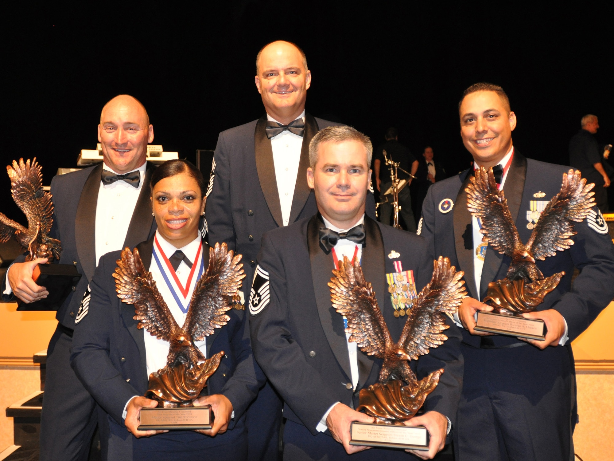 KISSIMMEE, Fla. -- Air Force Reserve Command honored its Outstanding Airmen of 2010 during an awards banquet here Aug. 16, 2011. AFRC Command Chief Master Sgt. Dwight Badgett (center) stands with honorees, from left, Chief Master Sgt. Leon Alexander, who accepted the Outstanding Airman Award on behalf of Staff Sgt. Michael D. Campbell, who is currently deployed; Tech Sgt. Ricardo A. Chavez, Outstanding NCO; Master Sgt. Tina Robinson, Outstanding First Sergeant; and Senior Master Sgt. Steven C. George, Outstanding Senior NCO. (U.S. Air Force photo/Philip Rhodes)
