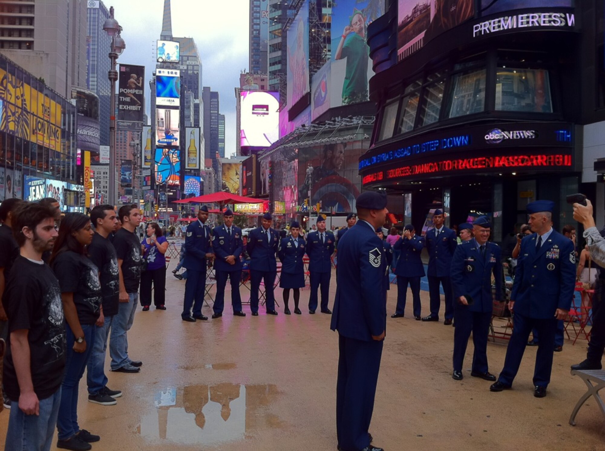 NEW YORK, N.Y. – Forty Delayed Enlistment Program members line up in Times Square here August 18 to reaffirm their commitment to enlist in the U.S. Air Force. The DEP swear-in is being covered by Defense Media Activity for Airman Magazine as part of their feature on the 10th anniversary of Sept. 11, 2001. (U.S. Air Force photo/Amy Bartholomew)