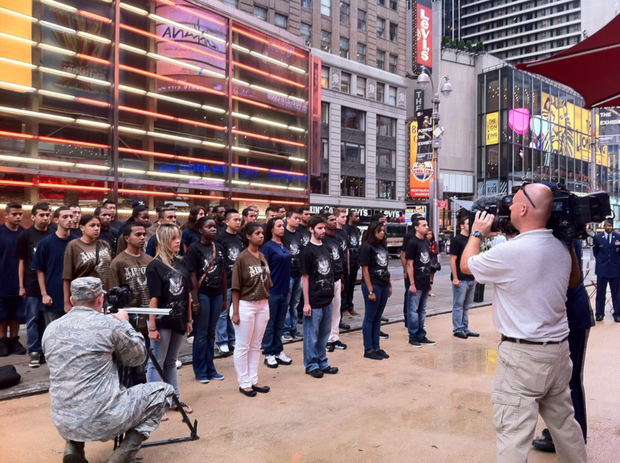 NEW YORK, N.Y. – Forty Delayed Enlistment Program members line up in Times Square here August 18 to reaffirm their commitment to enlist in the U.S. Air Force. The DEP swear-in is being covered by Defense Media Activity for Airman Magazine as part of their feature on the 10th anniversary of Sept. 11, 2001. (U.S. Air Force photo/Amy Bartholomew)