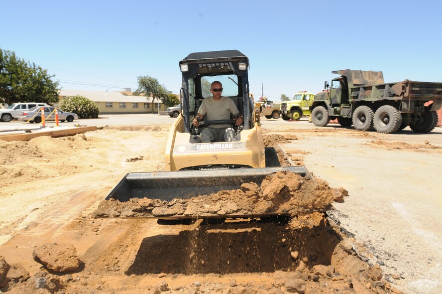 Tech. Sgt. Adam Cannon, heavy equipment operator team chief, operates a Catepillar 247B Multi Terrain Loader to level an area for a concrete pad. The 126th Civil Engineering Squadron, Illiinois Air National Guard, is assisting the California Army National Guard in renovations at Camp Roberts, Cali. The Army National Guard training base was created in 1941 to support troops leaving for World War II and is now in need of repairs to buildings and infrastructure. Air National Guard Civil Engineering squadrons, known as "Prime Beef" units when deployed, are using the opportunity to train on real world electrical, structural, plumbing and heavy equipment scenarios. This creates a  collaboration that proves valuable to both National Guard components.