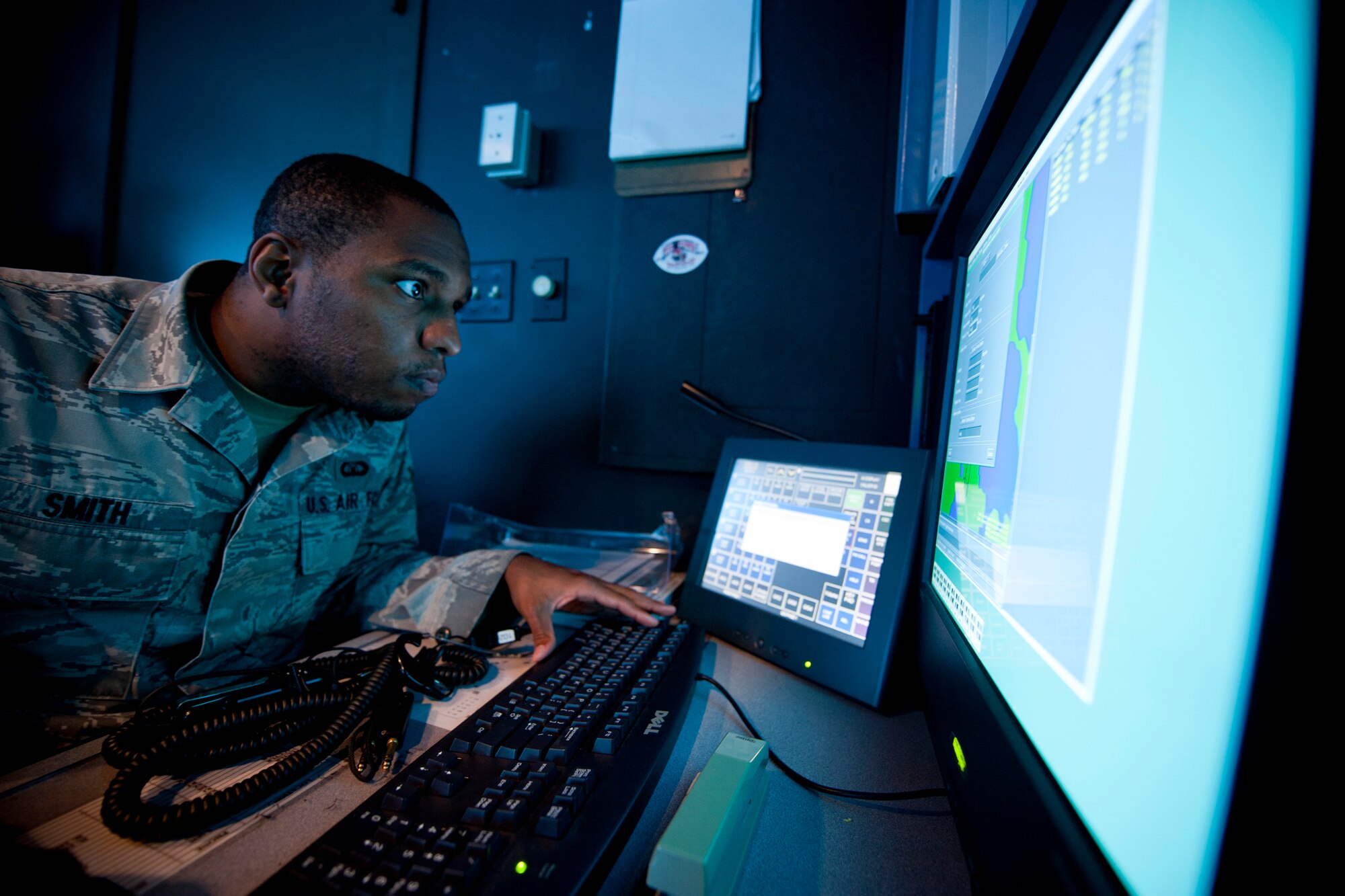 U.S. Air Force Senior Airman Darnell Smith, 23rd Operations Support Squadron air traffic controller and trainer, sets up a Tower Simulator System at Moody Air Force Base, Ga., Aug. 18, 2011. In addition to simulation training, new controllers are allotted time for personal study, live training and static training. Live training consists of interactive training during an actual operational setting while static training tests the controller’s decision-making abilities in reference to situations simulated on a map or diagram. (U.S. Air Force photo by Staff Sgt. Jamal D. Sutter/Released)