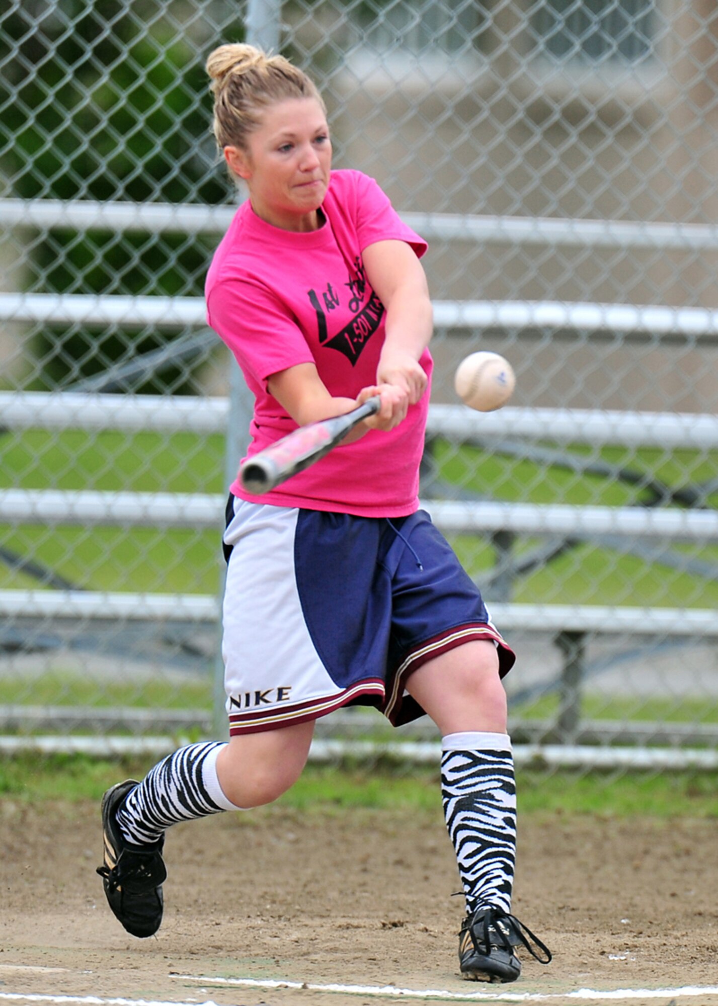 “1st Ladies” team member Brittany Dschaak hits a homerun during the Womens’ Intramural Softball Championship semi-final game.   (U.S. Air Force photo/Justin Connaher)
