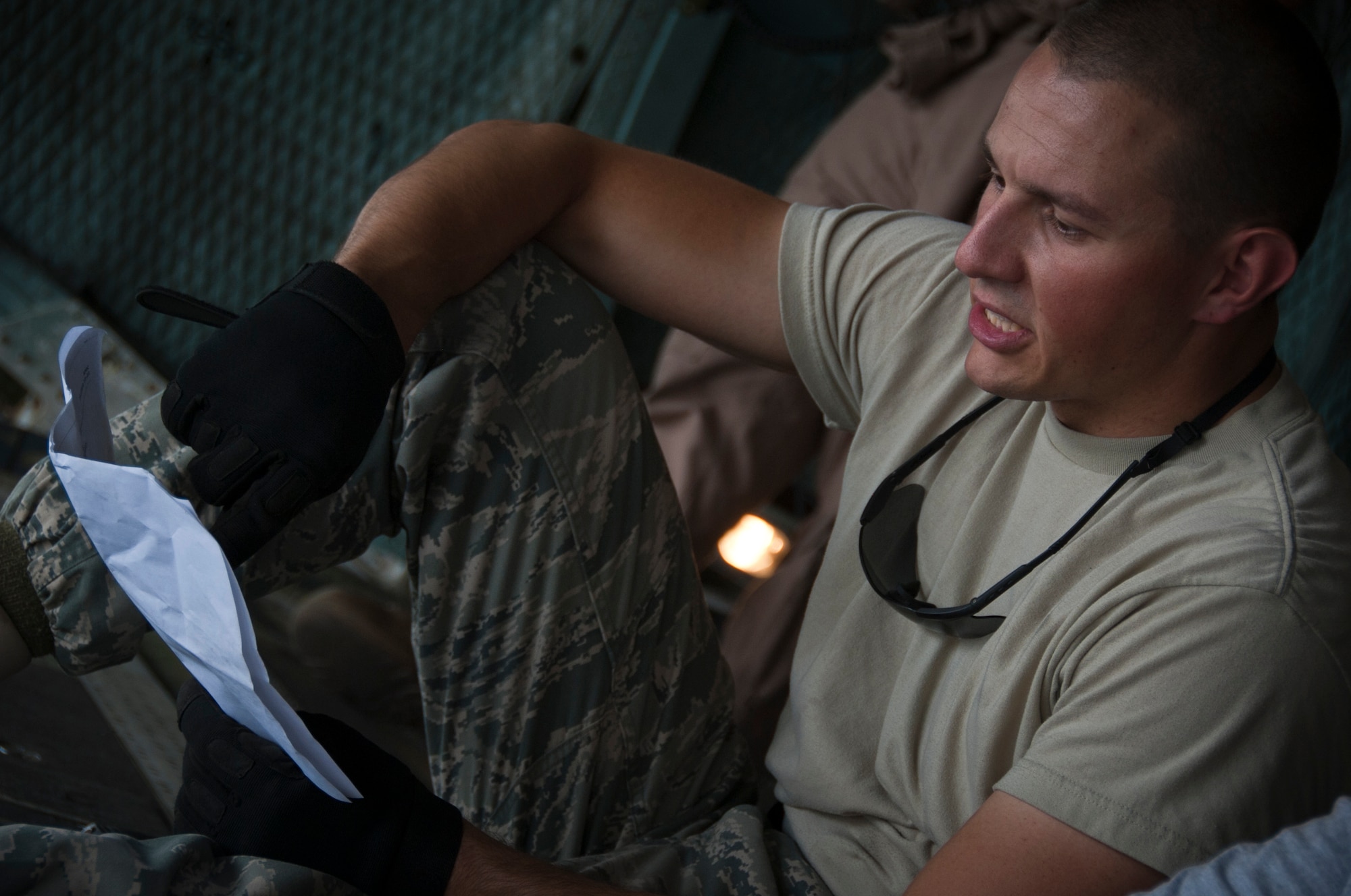 KANDAHAR AIRFIELD, Afghanistan -- Senior Airman Christopher Ott, 451st Expeditionary Logistics Readiness Squadron aerial port flight, looks over the load plan to load cargo into a C-5 Galaxy here Aug. 18, 2011. Ott and several members of the 451st ELRS aerial port assisted the load of an F/A-18 Super Hornet onto a C-5 Galaxy. This marked the first time the C-5 had been used to transport the F/A-18 back to the United States. After months of coordination and planning, senior leaders at the Navy’s Naval Air Forces and the Air Force’s Air Mobility Command approved a plan to transport the aircraft back to its home station at Naval Air Station North Island near San Diego, Calif. (U.S. Air Force photo by Senior Airman David Carbajal)